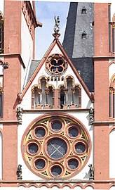 Rose window in the west front with early Gothic circular tracery