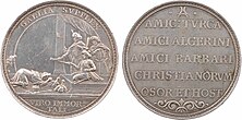 A medal with latin inscription in one side and an illustration of a monarch prostrating and offering a sword and a bag of money to a group of eastern looking dignitaries in the other side.