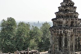 Stone tower and Angkor Wat far afield