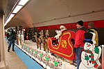 Santa riding a sleigh mounted on a flatcar for the 2006 CTA Holiday Train