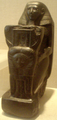 A kneeling statue of Senenmut, now in the Metropolitan Museum.