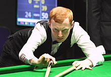 Anthony McGill (pictured in 2016) playing a shot with the rest