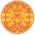 The seal of Thammasat University in Thailand consisting of a Constitution on phan with a twelve-spoked dhammacakka