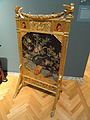 Fire screen of about 1880, with brocaded silk and gilded wood