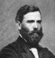 Old picture of man with beard and bow tie