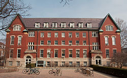 view of back side of Natural History Building from the south with student bike racks