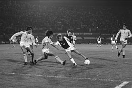 Players from Ajax and Tottenham in the European Cup Winners' Cup tie in 1981, Steve Perryman attempting to intercept a ball