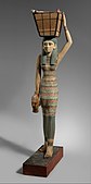 Figurine of a female servant carrying provisions; 1981–1975 BC; painted wood and gesso; 112 × 17 cm; Metropolitan Museum of Art (New York City)