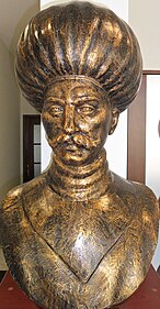 bronze bust of a turbaned man