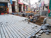 Replacing the old road with concrete blocks in Bo'ao Road area, Haikou City, Hainan, China
