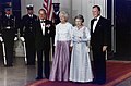 President George H. W. Bush and First Lady Barbara Bush with Queen Elizabeth II and Prince Philip, Duke of Edinburgh at the beginning of an official dinner at the White House, 1991