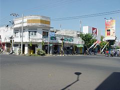 Street view in Singaraja, Bali, with a Djarum Super Compact Size advertisement in the far right, captured in 2005
