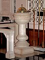 The marble baptism font inscribed in German