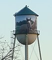 The water tower consists of a cone, a cylinder, and a hemisphere. Its volume can be calculated using solid geometry.