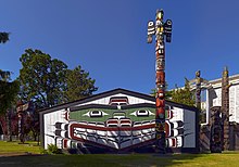 Thunderbird carving at the top of the totem pole in front of Wawadit'la, a Kwakwaka'wakw First Nation big house built by Chief Mungo Martin in 1953, located in Victoria, British Columbia