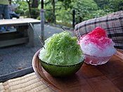 Green tea kakigōri (left) and strawberry flavoured kakigōri (right)
