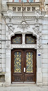 Door of Piața Mihail Kogălniceanu no. 7 in Bucharest, unknown architect (c. 1900)