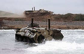 BTR-80s coming ashore, engine snorkels and waterjet deployed