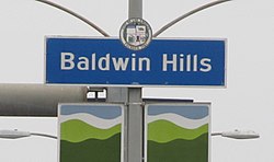 Baldwin Hills neighborhood sign located at the intersection of La Brea Avenue and Stocker Street