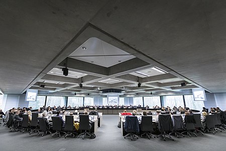 A large conference room with a two circular rows at the European Investment Bank headquarters in Luxembourg