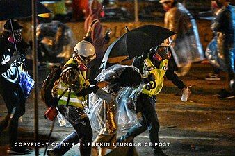 Volunteer first-aid personnel and medics helping injured protesters