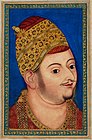 Deccan painting, Sultan Ibrahim Adil Shah II of Bijapur, c. 1590. A three-quarter view which gives a powerful and lively impression of the sitter, despite lacking both Mughal precision, and very coherent modelling of the surfaces.