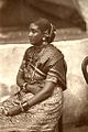 Woman in Tamil sari; in this style, the loose end is wrapped around the waist