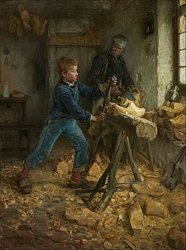 A boy making a wooden shoe, observed by an old man