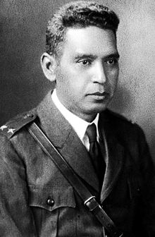 A black-and-white upper-body photograph of Maximiliano Hernández Martínez in early- to mid-20th century military dress uniform facing slightly to the right
