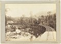 John Watt Beattie (c.1900) Mount Lyell railway showing train on King River Bridge