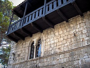 This house at Poreč, Croatia, has a reconstructed cantilevered wooden walkway, paired windows and the string course that were common features.