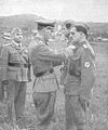 SS Lieutenant-General Erwin Rösener giving medals to Slovene Home Guard soldiers, c. 1944