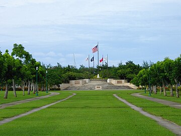 Perspective photograph of Park, which rises on wide stairs ending with a court and a flag circle of five flags