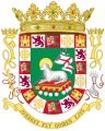 The Coat of arms of Puerto Rico features the Lamb of God and other symbols including the Kingdom of Jerusalem Cross and the Catholic Monarchs initials.