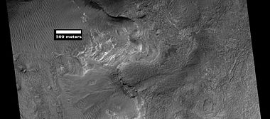Layers exposed in Nereidum Montes, as seen by HiRISE under HiWish program The light-toned layers may contain sulfates which are good for preserving traces of ancient life.