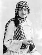 Woman wearing a 1920s head and neck scarf