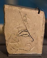 Limestone trial piece showing head of Nefertiti. Mainly in ink, but the lips were cut out. Reign of Akhenaten, Amarna. Petrie Museum