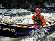 A whitewater canoeist on the Sacandaga River, Hadley, NY.