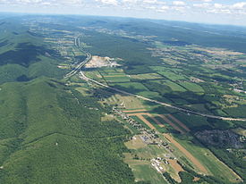 Aerial photo of Nittany Valley looking east from Milesburg with Bald Eagle Mountain on the left and Mount Nittany on the upper right