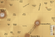 Map of Tharsis quadrangle with major features indicated. Tharsis contains many volcanoes, including Olympus Mons, the tallest known volcano in the Solar System. Ceraunius Tholus, although it looks small, is about as high as Earth's Mount Everest. The locations of some fossae are shown.