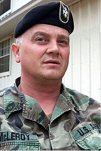 Caucasian male wearing battle dress uniform