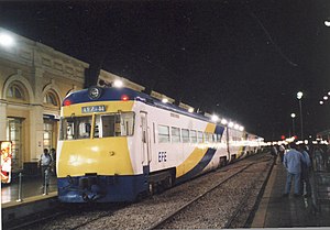 exterior of AEZ railcar at night in a station in Santiago
