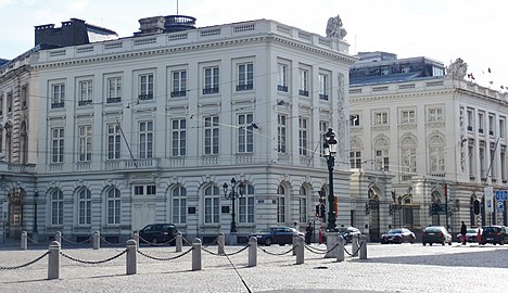 View of the palace from Place Royale with first the 18th-century Hôtel de Templeuve and further down the street the 19th-century extension