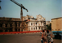 Buildings marked by fire and bullet holes on the northern edge of Revolution Square, Bucharest, July 1990