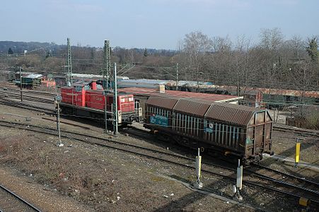 A switcher locomotive pushing a car over the hump at Kornwestheim yard.