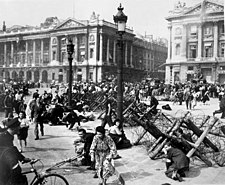 As allied troops enter Paris on 26 August, celebrating crowds on place De La Concorde scatter for cover from small bands of remaining German snipers.