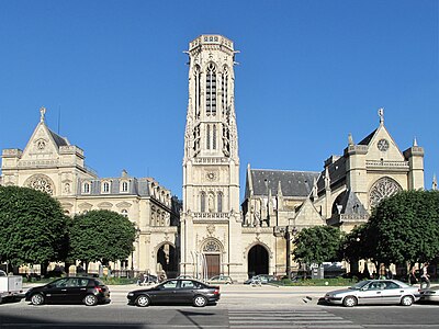 The neo-gothic bell tower of the city hall of the 1st arrondissement, by Théodore Ballu (1862), between the city hall (left) and the Church of Saint-Germain-Auxerois
