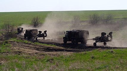 Ukrainian Army M777 howitzers towed by KrAZ-6322 trucks somewhere in the east of the country during the 2022 Russian invasion of Ukraine