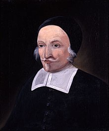 A painting of a man with a white moustache and small beard. He is wearing a skull cap and the bib of a colonial-era minister.