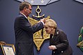 Secretary of Defense Ash Carter presents the medal to Madeleine Albright.